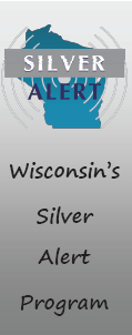 Tall silver banner with Wisconsin's Silver Alert Program text written on it